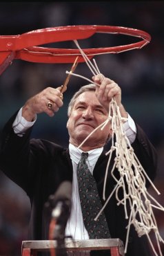 5 APR 1993: University of North Carolina head coach Dean Smith cuts the last loop of the net after his team defeated Michigan 77-71 earning North Carolina the championship title at the Superdome in New Orleans, LA. Rich Clarkson/NCAA Photos